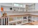 Well-organized pantry features custom shelves, wooden countertops, and a bright window at 3901 Laurel Creek Ln, Wake Forest, NC 27587