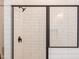 Modern shower with white subway tile and black trim at 3901 Laurel Creek Ln, Wake Forest, NC 27587