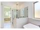 Modern shower with glass enclosure and wall-mounted handheld shower fixture at 3901 Laurel Creek Ln, Wake Forest, NC 27587
