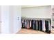 Walk-in closet with a clothes rack, custom shelves, and storage cabinets at 3901 Laurel Creek Ln, Wake Forest, NC 27587
