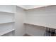 Spacious walk-in closet with shelving and hanging rods at 3901 Laurel Creek Ln, Wake Forest, NC 27587
