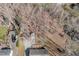 A lovely aerial view of the home's wooded lot with a long driveway at 4508 Regis Ave, Durham, NC 27705