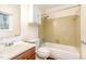 Bathroom featuring retro-style tile, single vanity, and a shower-over-tub combination at 4508 Regis Ave, Durham, NC 27705