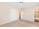 Bedroom with carpet floor, neutral walls and direct access to a private bathroom with tub at 4508 Regis Ave, Durham, NC 27705