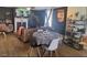 Cozy dining area featuring a table with four chairs and laminate flooring throughout the room at 614 Oak St, Burlington, NC 27215