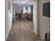 Hallway with laminate flooring and white walls at 614 Oak St, Burlington, NC 27215
