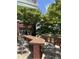 Outdoor kitchen features a built-in grill, bar seating, and mature shade trees in a brick structure at 618 N Boylan Avenue # 300, Raleigh, NC 27603