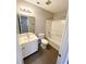 Bathroom features a tub/shower combo, toilet and sink with vanity at 6221 Tributary Dr, Raleigh, NC 27609