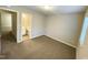 Bedroom with carpeted floors and view of a bathroom at 6221 Tributary Dr, Raleigh, NC 27609