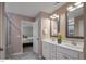 Bathroom featuring double vanity sinks, modern fixtures, and walk-in shower at 69 White Azalea Way, Homesite 81, Benson, NC 27504