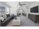 Cozy bonus room featuring vaulted ceiling, comfortable seating and workspace at 69 White Azalea Way, Homesite 81, Benson, NC 27504