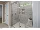 Modern shower with tile surround, glass door and convenient corner niche at 69 White Azalea Way, Homesite 81, Benson, NC 27504