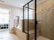 Luxurious bathroom featuring a separate tub and shower with tiled walls at 730 Toms Creek Rd, Cary, NC 27519