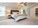 Inviting bedroom with plush carpeting, a comfortable bed, and abundant natural light at 730 Toms Creek Rd, Cary, NC 27519