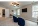 Bonus room featuring a TV, seating, tables, and windows with lots of natural light at 730 Toms Creek Rd, Cary, NC 27519