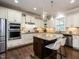 Bright and spacious kitchen with granite countertops, stainless steel appliances, and custom cabinetry at 730 Toms Creek Rd, Cary, NC 27519