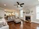 Open concept living room flowing into a modern kitchen with hardwood floors at 730 Toms Creek Rd, Cary, NC 27519