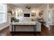 Stylish living room featuring hardwood floors, custom cabinets, and a cozy seating arrangement at 730 Toms Creek Rd, Cary, NC 27519