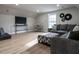 This living room features laminate wood floors, recessed lighting, and a comfortable sectional sofa at 730 Toms Creek Rd, Cary, NC 27519