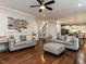 Inviting living room with hardwood floors, stylish decor, and seamless access to the kitchen at 730 Toms Creek Rd, Cary, NC 27519