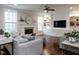 Bright living room featuring a fireplace, custom built-ins, and hardwood floors at 730 Toms Creek Rd, Cary, NC 27519