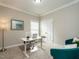 Bright office space with neutral colors, modern desk, and cozy teal armchairs at 730 Toms Creek Rd, Cary, NC 27519
