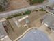 Aerial view of backyard recreational facilities like bocce ball and a shed at 74 Powderhorn Pt, Garner, NC 27529