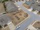 This aerial view showcases the neighborhood garden with raised beds, seating area, and surrounding well-maintained homes at 74 Powderhorn Pt, Garner, NC 27529