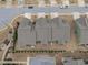 Aerial view of homes showcasing rooflines, landscaping, and street layout at 74 Powderhorn Pt, Garner, NC 27529