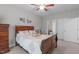 Comfortable bedroom with a wood sleigh bed, soft lighting, and ensuite bath at 74 Powderhorn Pt, Garner, NC 27529