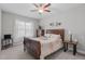 Inviting bedroom featuring a wood sleigh bed, soft lighting, and a peaceful ambiance at 74 Powderhorn Pt, Garner, NC 27529