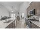 Bright open concept kitchen features stainless appliances, granite countertops, and ample storage at 74 Powderhorn Pt, Garner, NC 27529