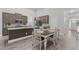 Open kitchen features a large island, stainless appliances, and hardwood floors at 74 Powderhorn Pt, Garner, NC 27529