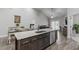 Gourmet kitchen features granite countertops, stainless appliances, and views of the living room at 74 Powderhorn Pt, Garner, NC 27529