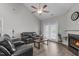 Cozy living room with a fireplace, wood floors, and comfortable leather seating, perfect for relaxing at 74 Powderhorn Pt, Garner, NC 27529