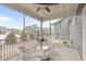 Relaxing screened porch with wicker furniture and views of the community at 74 Powderhorn Pt, Garner, NC 27529