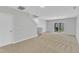 Large finished basement area with carpet and stairs leading to the upper level at 8415 Reedy Ridge Ln, Raleigh, NC 27613