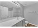Bright bathroom with a white vanity, a large mirror and a shower/tub combo at 8415 Reedy Ridge Ln, Raleigh, NC 27613