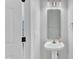 Well-lit powder room with pedestal sink and modern fixtures at 8415 Reedy Ridge Ln, Raleigh, NC 27613