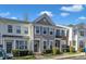 Charming townhome with well-maintained landscaping, neutral siding, and inviting front entrance at 8415 Reedy Ridge Ln, Raleigh, NC 27613