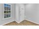 Bright foyer featuring a window and white front door and vinyl floors at 8415 Reedy Ridge Ln, Raleigh, NC 27613