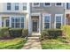 Inviting front entrance with a decorative wreath and well-manicured landscaping at 8415 Reedy Ridge Ln, Raleigh, NC 27613