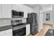 Well-equipped kitchen with stainless steel appliances and ample cabinet space at 8415 Reedy Ridge Ln, Raleigh, NC 27613