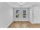 Spacious living room with hardwood floors and views of the neighborhood at 8415 Reedy Ridge Ln, Raleigh, NC 27613