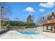 The community pool features a large swimming area and sunbathing lounge chairs at 8415 Reedy Ridge Ln, Raleigh, NC 27613
