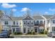 View of well-maintained townhomes, showcasing the community's convenient parking and curb appeal at 8415 Reedy Ridge Ln, Raleigh, NC 27613