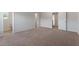 Spacious carpeted bedroom with neutral walls, multiple closets, and plenty of light at 903 Rhino Bnd, Oxford, NC 27565