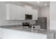 Bright kitchen featuring stainless steel appliances and granite countertops at 903 Rhino Bnd, Oxford, NC 27565