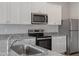 Modern kitchen featuring stainless steel appliances and granite countertops at 903 Rhino Bnd, Oxford, NC 27565