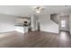 Open-concept living room with modern flooring, neutral paint, and an eat-in kitchen at 903 Rhino Bnd, Oxford, NC 27565